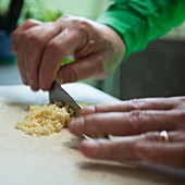 Garlic being chopped