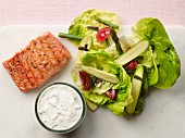 Salmon with lettuce, asparagus, courgette and ranch dressing