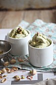 Two cups of pistachio ice cream