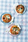 Mini pizzas with peppers, tuna fish and olives