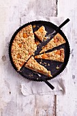 Gluten-free apricot cake with cashew nut mousse and sesame seed crumbs