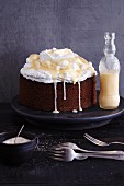 Gluten-free walnut cake topped with cream and eggnog