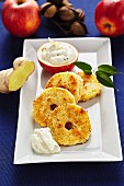 Fried apple and coconut rings with ginger and quark cream