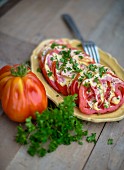 Beefsteak tomatoes with mustard sauce and parsley