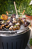 Spicy aubergine & tofu kebabs on a barbecue