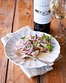 Angelfish ceviche with red onions