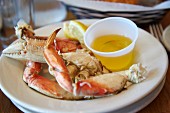 Crab legs with liquid butter in a restaurant