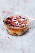 Cherry clafoutis with pink pepper in a glass