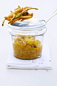 Yellow lentil darling with asparagus and lime leaf pakoras in a jar