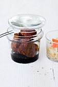 Pork belly in ginger confit with a papaya and peanut salad in a jar