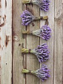 Several bunches of lavender on a wooden surface