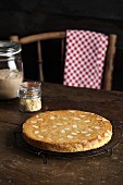 A freshly baked Bakewell tart on a cooling rack