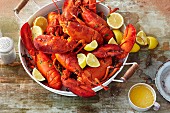 Cooked lobster with lemon and melted butter