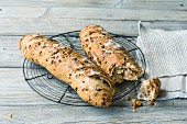 Tomato and poppyseed baguettes made from sour dough