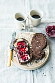 Chocolate bread with hazelnuts served with butter and jam