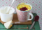 A cheese mug cake with raspberry jam