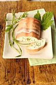 Cream cheese terrine with herbs wrapped in ham