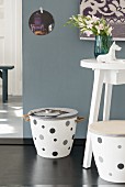 A white homemade stool decorated with grey spots