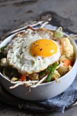 Bulgur with vegetables and fried egg