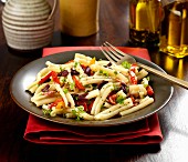 Gluten-free pasta with peppers, olives, herbs and olive oil