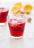 Raspberry lemonade with lemon juice and ice cubes