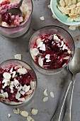 Rice pudding with cherries and flaked almonds (seen from above)