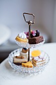 Petits fours on a cake stand at the Kapstachelbeere cafe and patisserie, Berlin