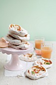 Meringues with guava coulis and pistachio nuts
