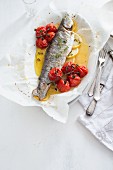 Baked trout with cherry tomatoes and lemon