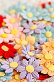 Cake decorations - coloured fondant daisies