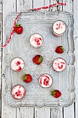 Homemade buttermilk ice cream with strawberries in glasses on a tray