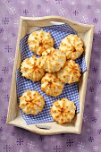 Coconut macaroons on a wooden tray