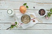 Muesli with dried fruits, nuts, apple and milk
