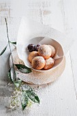 Ricotta dumplings with cherries and icing sugar