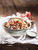 Wheat salad with pomegranate seeds and herbs