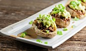Potatoes filled with minced meat and avocado cream