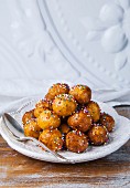 Struffoli (Italian honey balls) with coloured sugar sprinkles