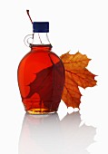 Maple syrup and a maple leaf