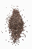 Chia seeds on a white surface