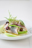 Soused herring with cranberries and apple