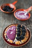 Blackberry tart with blueberry sauce