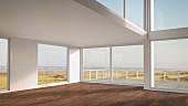 Leeres Ferienhaus mit grosszügigen Fensterfronten in Dünenlandschaft am Nordseestrand