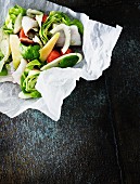 Fish and vegetables in parchment paper