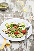 Grilled courgettes strips with soya beans, tomatoes and basil
