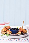 French toast rolls with cinnamon and Brie served with blueberry compote