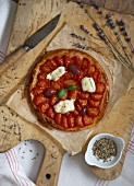 Tomato,mozzarella and black olice pizza