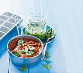 Basil pesto and tomato sauce with basil leaves
