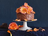 A chocolate ganache cake decorated with roses