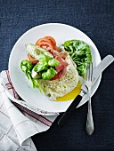Fried egg with ham, avocado and tomatoes