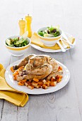 Garlic chicken with pumpkin and a side salad (Italy)